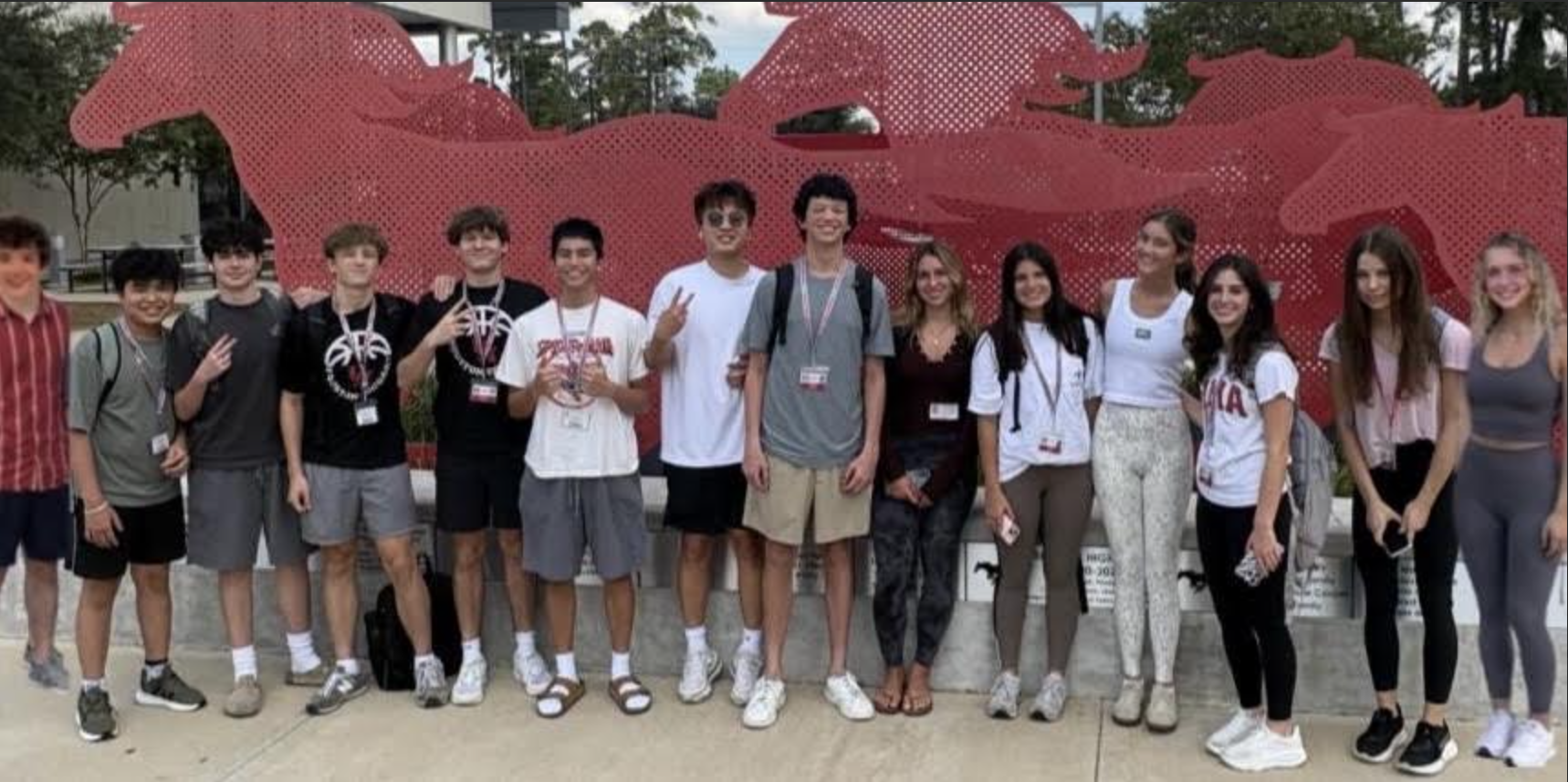 The fifteen students of MindfulMission HTX standing together at school