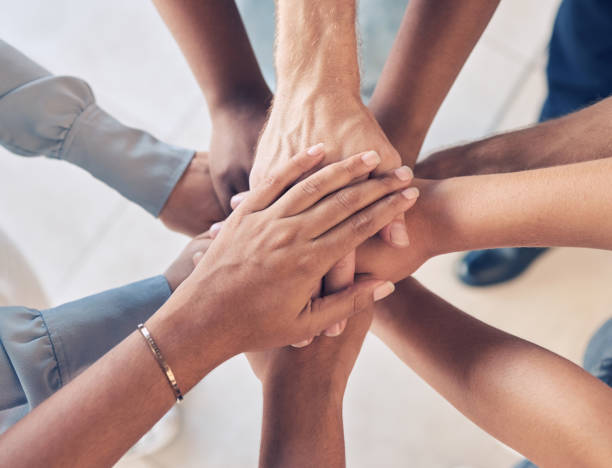 Our team with our hands in together before an event